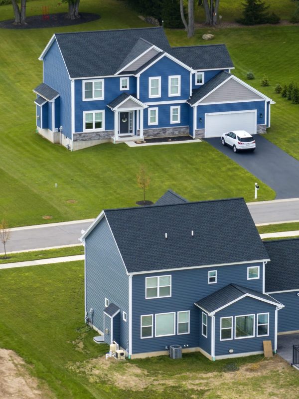 View from above of residential houses in living area in Rochester, NY. American dream homes as example of real estate development in US suburbs.